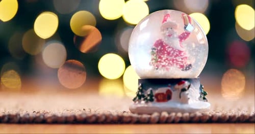 Christmas, snow globes or decoration on table for celebration, giving or happiness in home