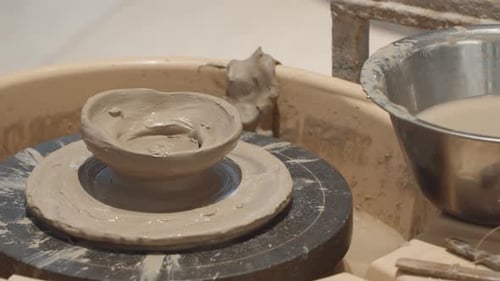 Mud Clay Molded Over Rotating Pottery Wheel. Close-up Shot