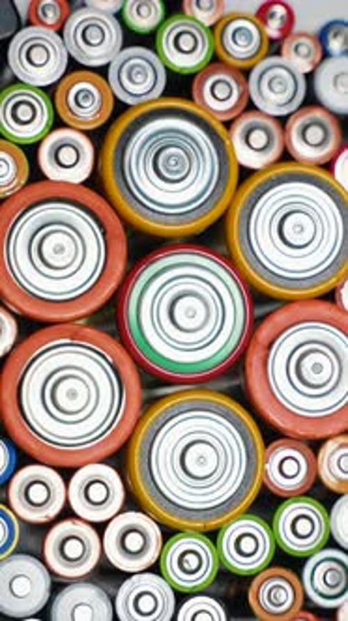 Old Used Batteries Type AA AAA D Rotate in a Circle Vertical Video