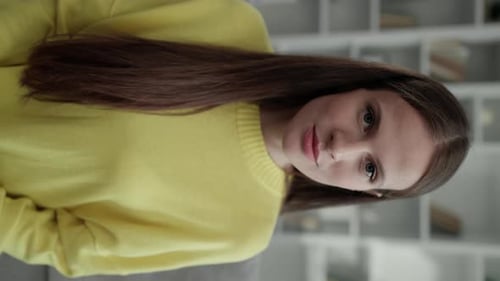 Vertical Video Young Adorable Woman Looking at the Camera Sitting at Home Office Portrait of the
