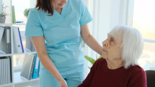 Nurse Attends to Senior Woman in Bright Setting