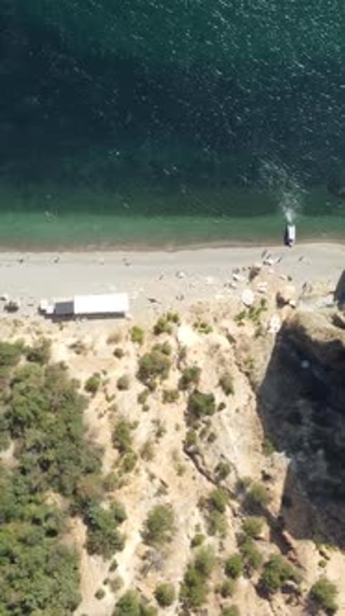 Aerial View on Calm Azure Sea and Volcanic Rocky Shores Small Waves on Water Surface Nature Summer