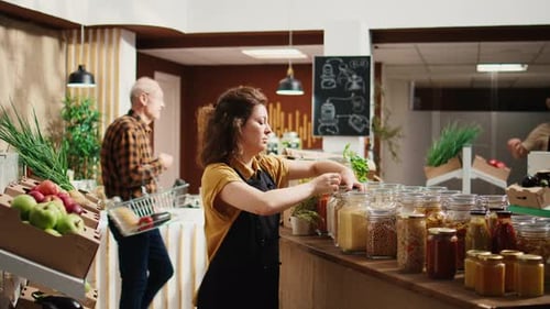 Employee Restocks Local Grocery Store