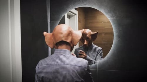 Back View of Creapy Scary Man with Horror Pig Mask Prepare for Night Put Some Perfume