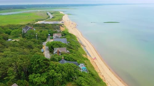 Aerial View of Beachfront Homes and Sandy Beach