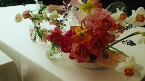 Elegant Floral Arrangement on White Tablecloth