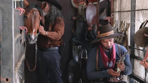 Cowboys Prepping Horse and Gun in Rustic Stable