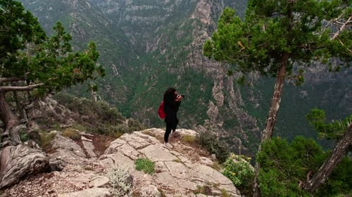 Take A Photograph On The Edge Of Cliff