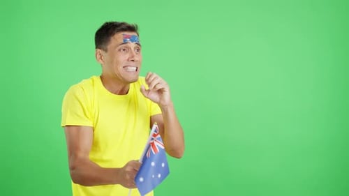Nervous Man Cheering for Australia During a Match Looking Away