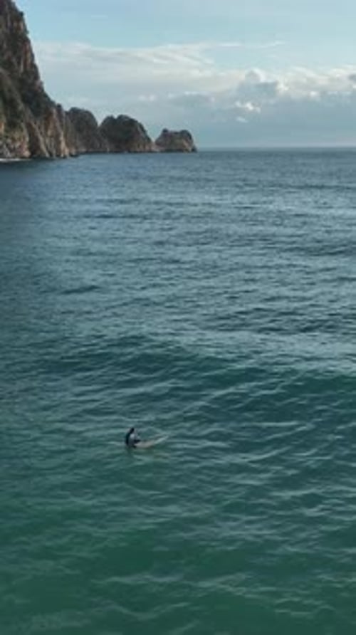 Vertical Video Mesmerizing Aerial Capture Thrilling Surfing Moments in the Azure Sea of Alanya