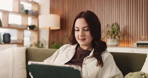 Woman, student and reading with tablet in home for research, education and university application