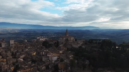 Drone capturing Todi cityscape and surrounding valley in Umbria, Italy