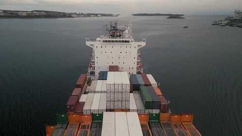 Ocean Freight Cargo Ship Cruising Towards Halifax Aerial Perspective