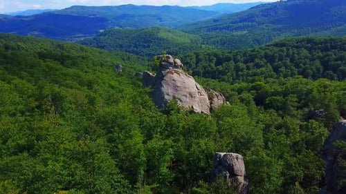 Aerial View of Rolling Hills and Rock Outcrops