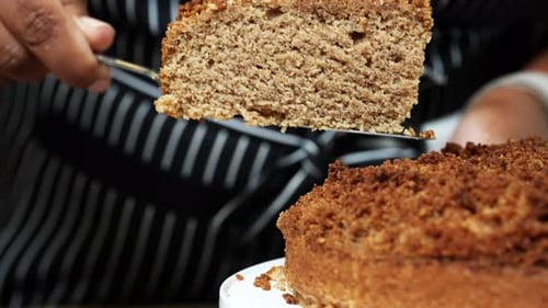 Holding Slice of Cake Ready to be Served