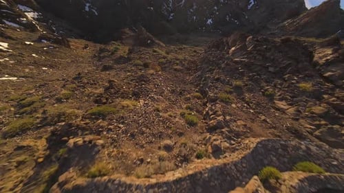 Aerial View of Rocky Mountain Terrain at Sunrise