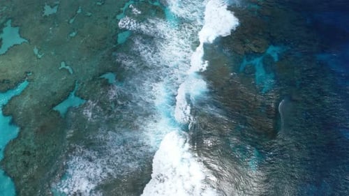 The drone's shot captures the blue lagoon in all its glory, showcasing the clear waters that reveal