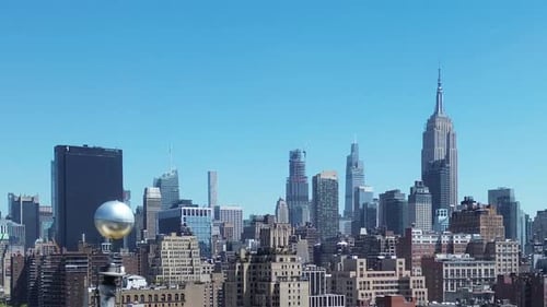 American Flag Waves Over Majestic City Skyline