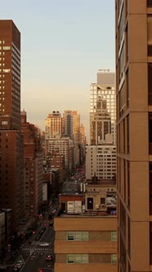 Urban Reflections at Dusk A Modern Building Facade Illuminated By Sunsets Glow