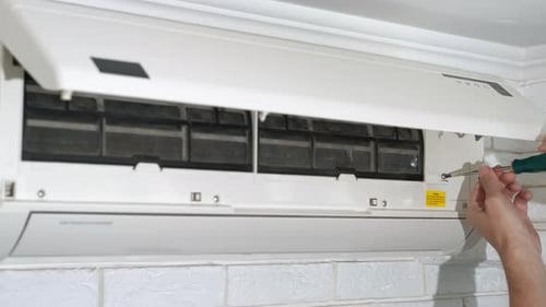 Air Conditioner Repair with Screwdriver, Close Up