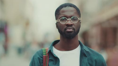 Serious Young African American with Glasses Look at Camera Portrait Close Up Standing in City Face