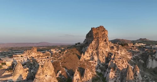Aerial View of Natural Rock Formations in the Sunset Valley with Cave Houses in Cappadocia Turkey