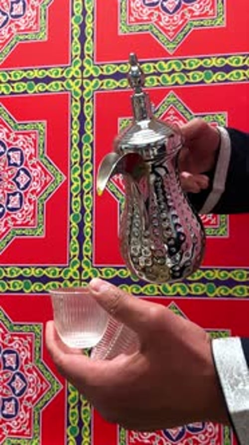 Traditional Arabic Coffee Pouring Against Bright Ramadan Backdrop – 4K Footage