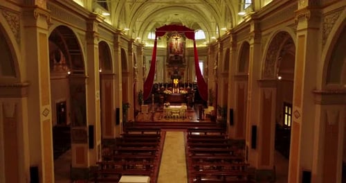 Lodi, Italy - 12 May 2018: Aerial view with drone inside a Christian church. Inside you can see cr