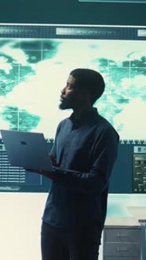 Young Man Working with Tech in Futuristic Workplace
