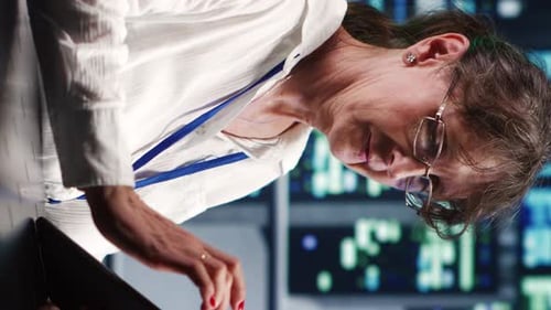 Woman Using Tablet in a Data Center