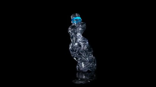 Crumpled Plastic Bottle Rotating on Black Background