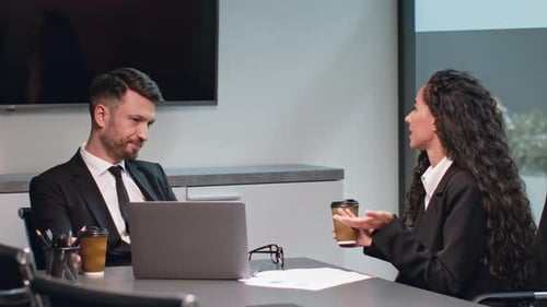 Business Professionals Collaborating in Modern Office Environment During Meeting