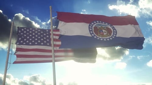 USA and Missouri Flags Waving Against Cloudy Sky