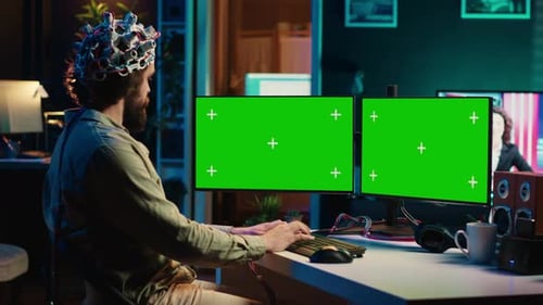 Computer Engineer Starting Mind Upload Process Using Green Screen PC