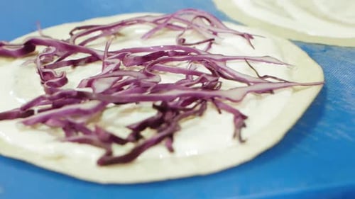 Chef Prepares Tortillas with Red Cabbage Close Up