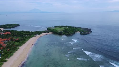 Island Shoreline Scenery Beach With Vibrant Reef And Distant Volcano