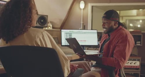 Producer and Singer Writing Song in Recording Music Studio