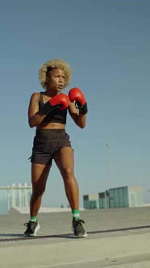Athletic Woman Shadow Boxing Outdoors