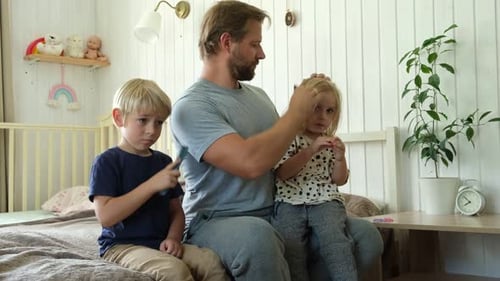 Dad Combing Daughter's Hair in Bright Bedroom