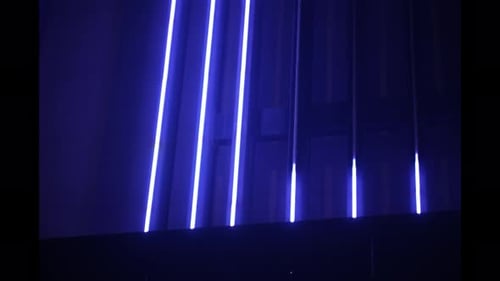 Neon Light Bars Against Dark Curtains