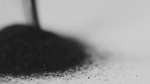 Dark Grains Fall, Forming Heap, Black and White