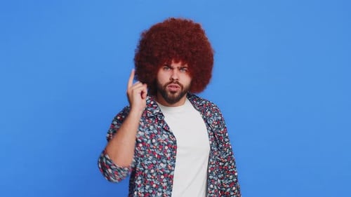 Man With Afro Wags Finger Sternly