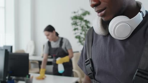 Young Cleaning Service Worker Texting Message