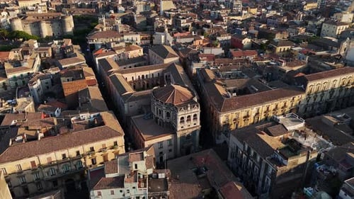 A mediterranean city with historic buildings and tiled rooftops, aerial view
