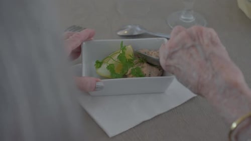 Senior Woman Preparing Salad With Spoon