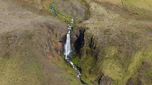 Aerial view of waterfall in canyon, Iceland.