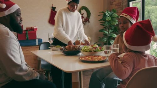 Family Celebrates Christmas with Festive Holiday Meal