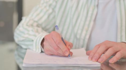 Close up of Man Writing a Letter