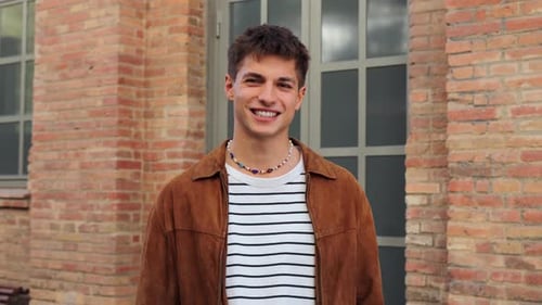 Portrait of One Student Teenage Male Smiling and Looking at Camera at University Campus Guy Standing