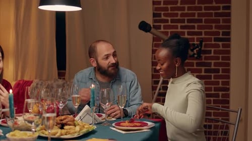 Friends Gather for a Cozy Indoor Dinner Party